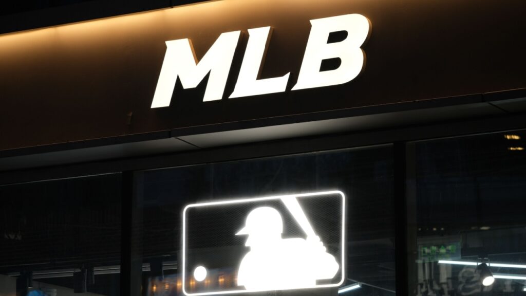 Close up Major League Baseball (MLB) sign at night.