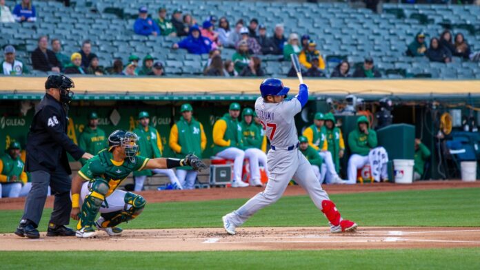 Chicago Cubs outfielder Seiya Suzuki hits against the Oakland Athletics at the Oakland Coliseum.