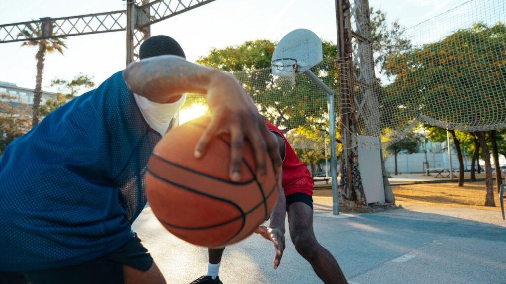 One vs one basketball game training at the court.