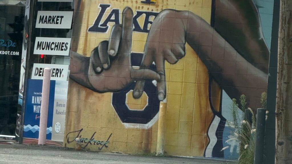  Street art mural of former Los Angeles Lakers player Kobe Bryant wearing jersey number 8.