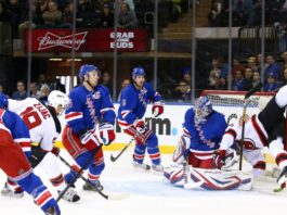 New Jersey Devils center Travis Zajac (19) and left wing Patrik Elias (26) against New York Rangers goalie Henrik Lundqvist (30) at Madison Square Garden.