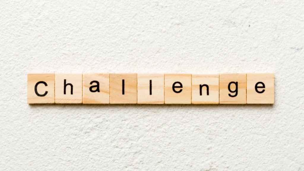 Challenge word written on wood block.