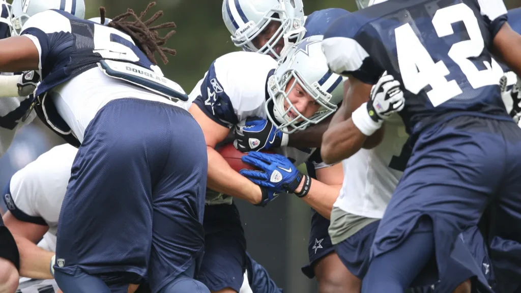 chris gronkowski tries to break a tackle during the second