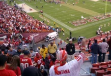 The Evolution of Stadium Fan Experiences in Modern NFL Fans cheer as 49ers celebrate win on field.