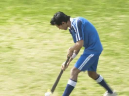 Hockey player in a field.
