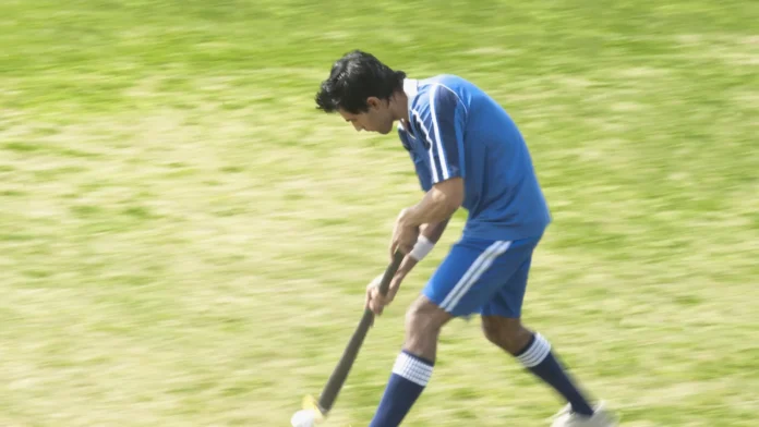 Hockey player in a field.