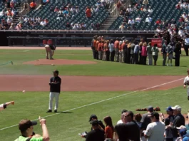 pitcher matt cain warms as he throws to catcher buster