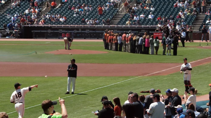 pitcher matt cain warms as he throws to catcher buster