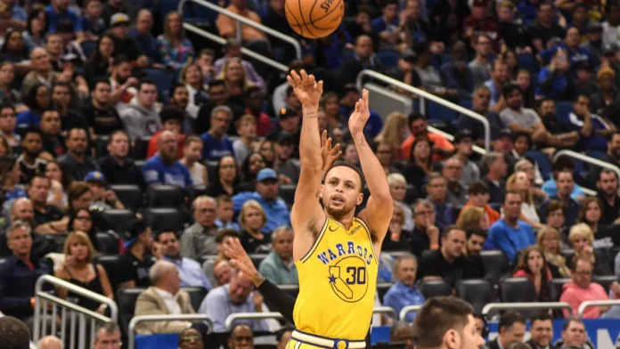 Steph Curry making a shot during a basketball match.