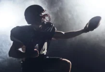 Rodgers and Steelers win AFC North after Ravens’ last‑second field goal miss American football player holding football.