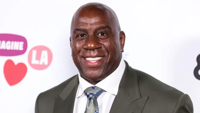 Former American professional basketball player Magic Johnson Earvin Johnson Jr. smiling into the camera.