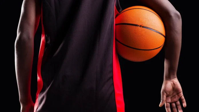 Back view of a basketball player with basket ball.