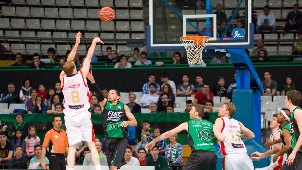 Player making basketball shot.