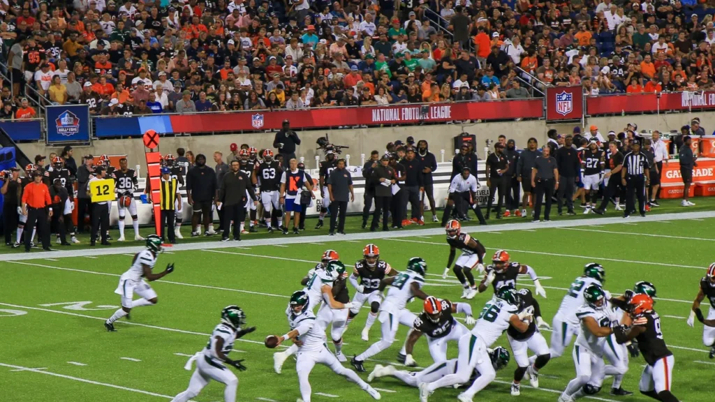 Cleveland Browns playing football match on the field against opponents.