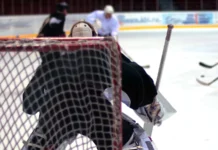 Rangers look to snap three-game slide against division-leading Bruins Back view of a hockey goalie.
