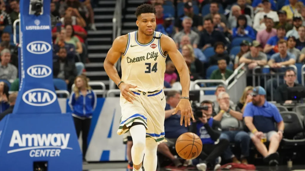 Giannis Antetokounmpo playing basketball.