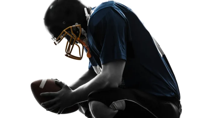 defeated american football player man silhouette