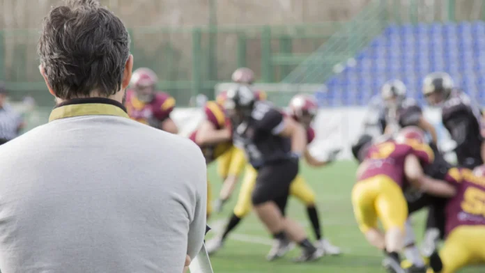 football coach looking the game