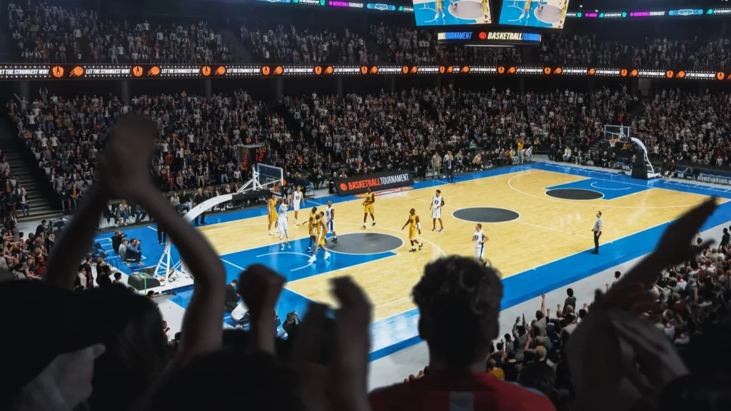 Basketball fans cheering in arena during NBA game.