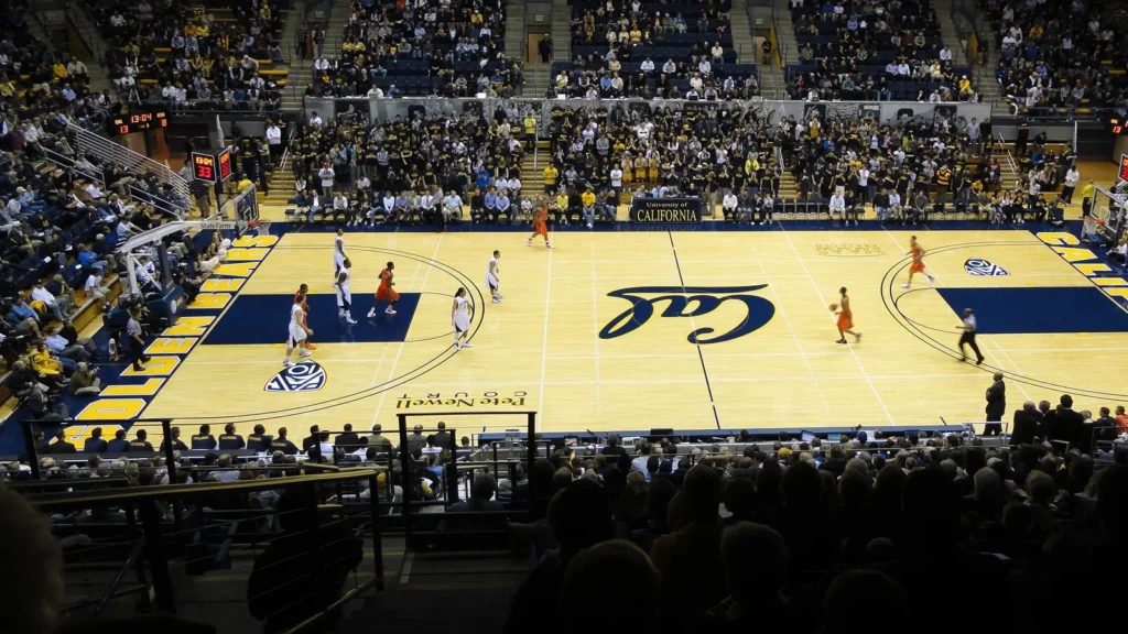Aerial view of a professional basketball arena with a full crowd during a game.
