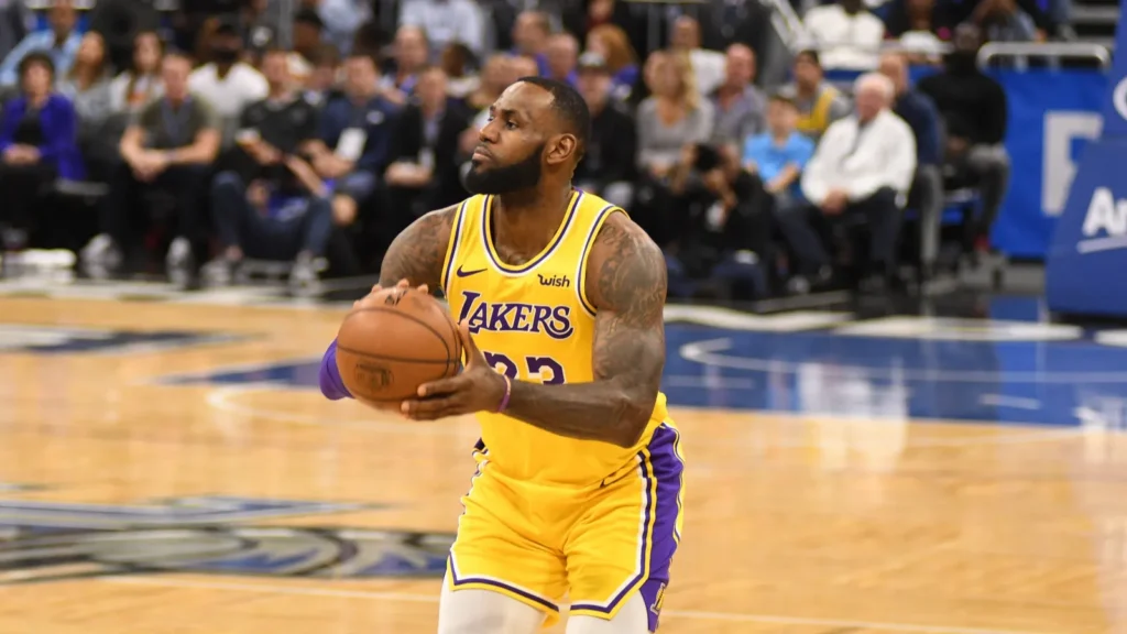 LeBron James preparing to shoot the ball through basket.