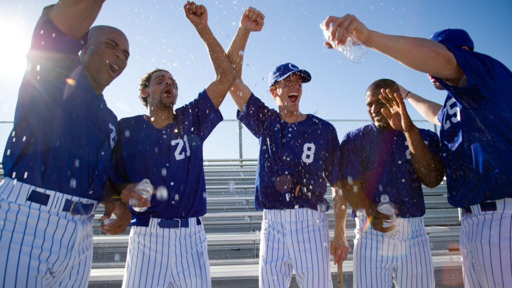Baseball players celebrating victory.