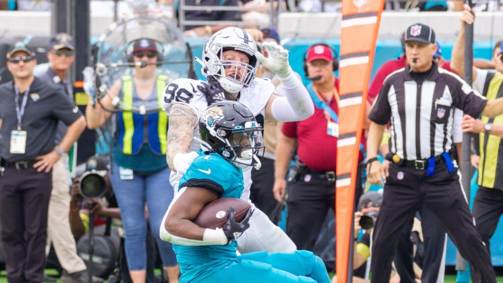 Maxx Crosby in action during a football game.