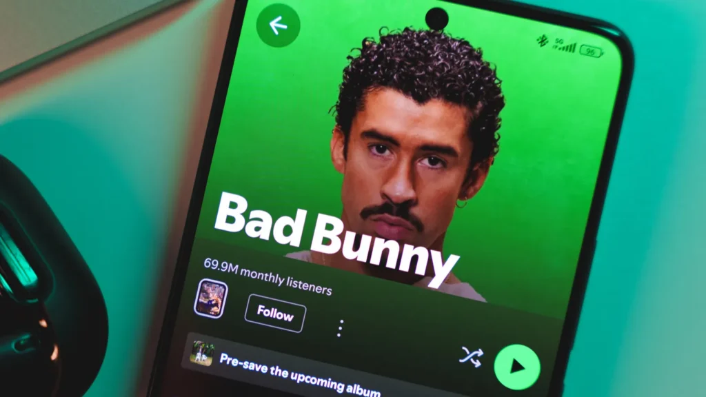 a smartphone displaying bad bunnys artist profile on spotify january