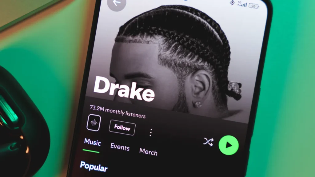 a smartphone displaying drakes artist profile on spotify january 5