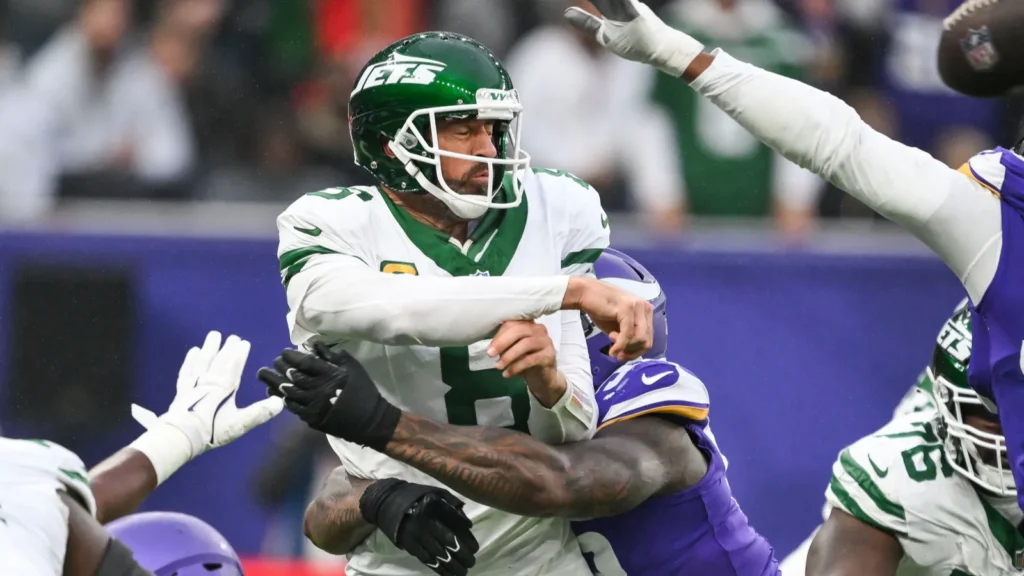 aaron rodgers of the new york jetsis hit by jonah