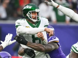 Aaron Rodgers hit by an opponent player during the game.