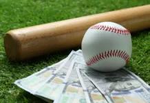 MLB players who signed short deals and cashed in later baseball ball bat and dollar banknotes on green grass outdoors