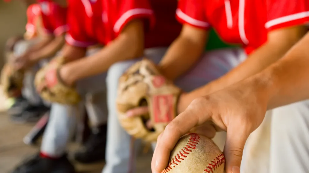 Baseball teammates in the dugout.