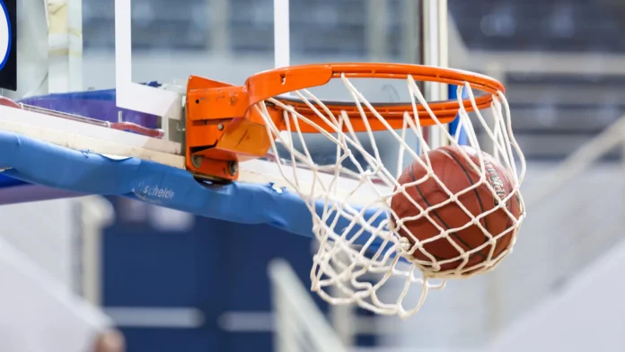Basketball passing through the hoop Basketball passing through the hoop