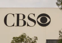 Tony Romo left in limbo as CBS makes no final call on future cbs logo on a building in los angeles