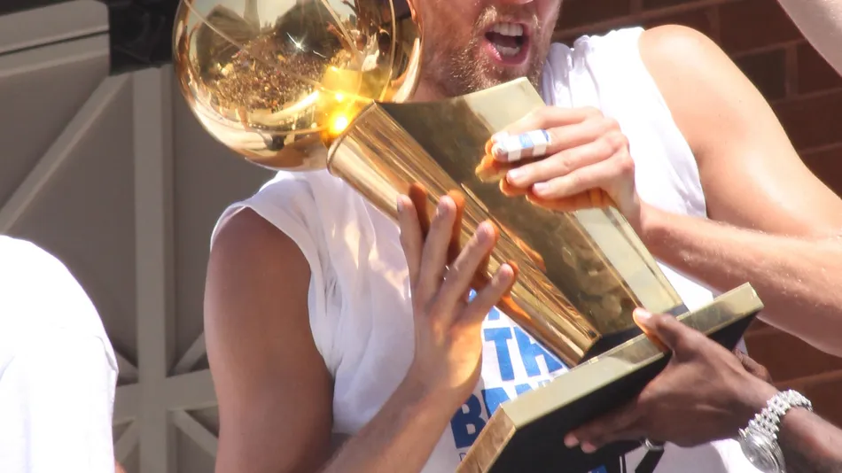 dirk nowitzki of the dallas mavericks nba team carrying the