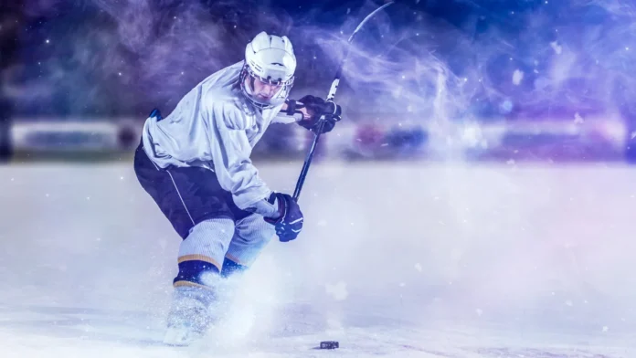 ice hockey player in action kicking with stick