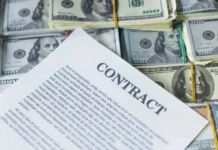 Several quarterbacks line up for big paydays after Mahomes deal Top-shot of a contract above piles of money