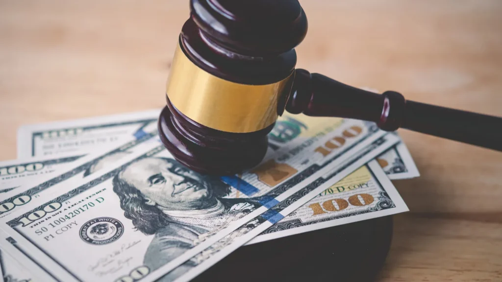 law and justice concept judge hammer with the dollar placed