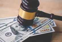 NBA suspensions handed out after Detroit Pistons and Charlotte Hornets fight involving Isaiah Stewart and Jalen Duren law and justice concept judge hammer with the dollar placed