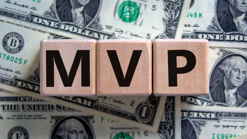 Scrabble blocks spelling out the word "MVP"