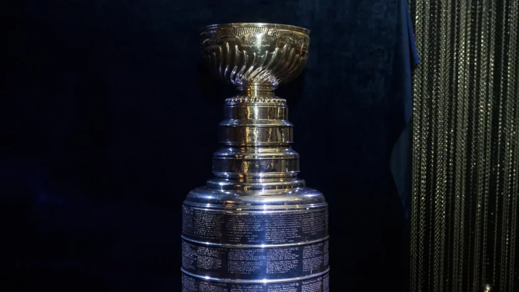The Stanley Cup trophy displayed against a dark background