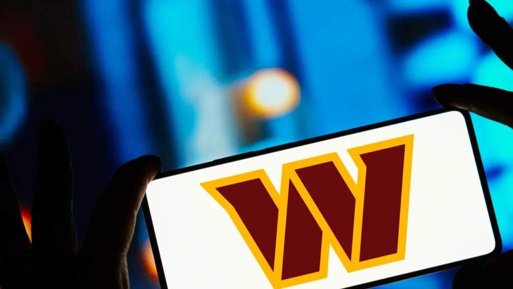 Washington Commanders logo on an mobile phone.
