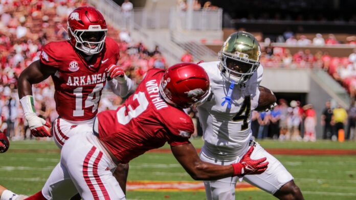 Jeremiyah Love running through the defense