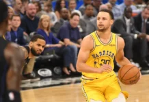 Warriors’ Stephen Curry sidelined at least 10 more days with right knee injury Stephen Curry playing basketball