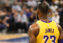 LeBron James explains why Miami’s Big Three fell short of expectations Lebron James standing with his back to the camera in the basketball court.