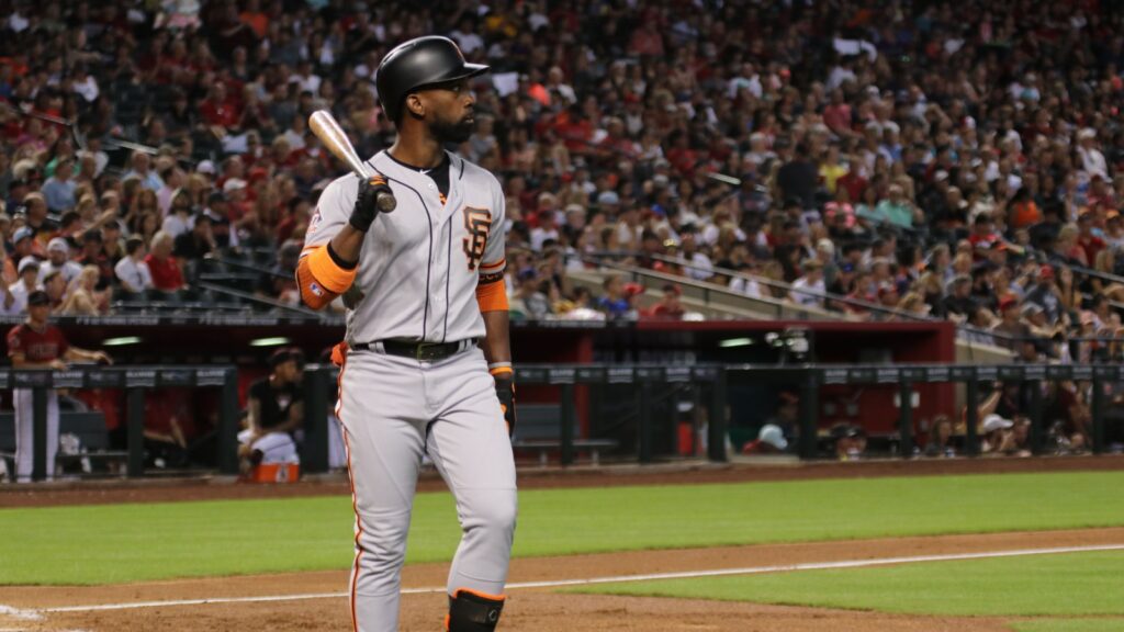 Andrew McCutchen standing, holding a bat on his shoulder during a baseball game.