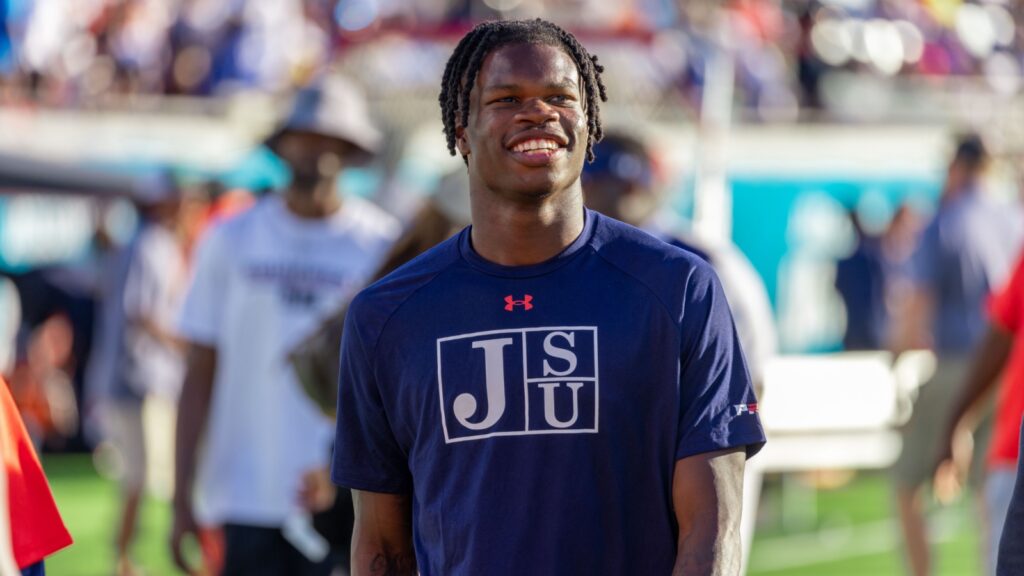 Travis Hunter at the football field during warm-ups.