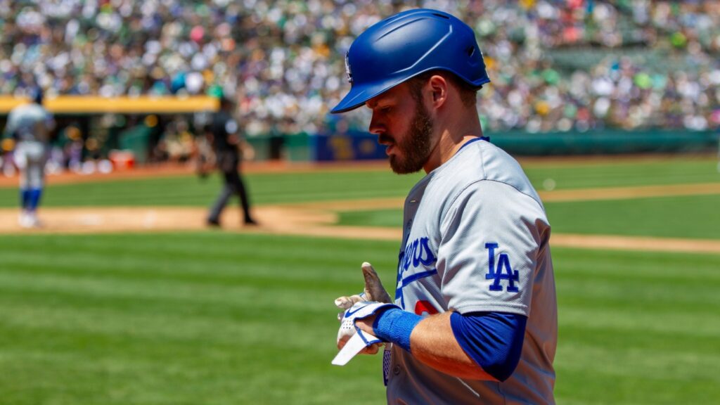 Gavin Lux walking on the field during a game.