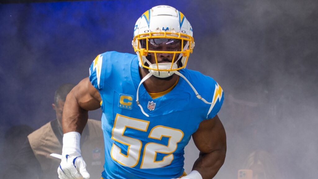 Khalil Mack running on the field before football game.